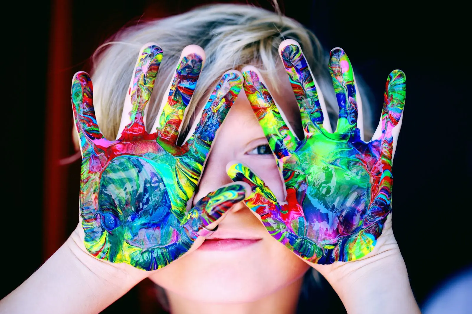 Colourful painted hands used as a reference image for creative activity