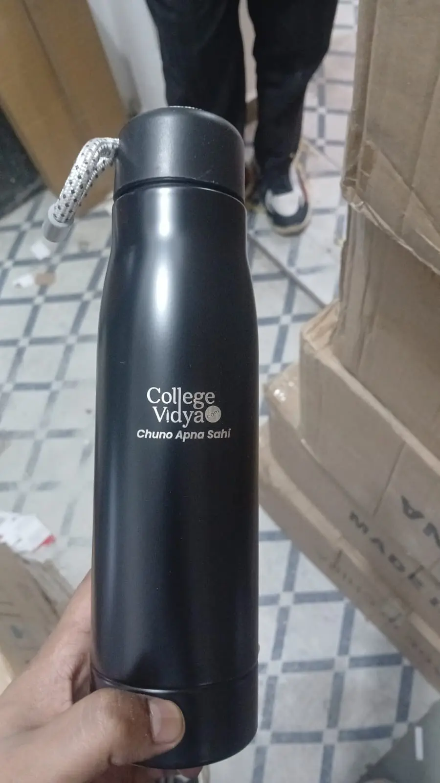 Black insulated bottle printed with College Vidya branding