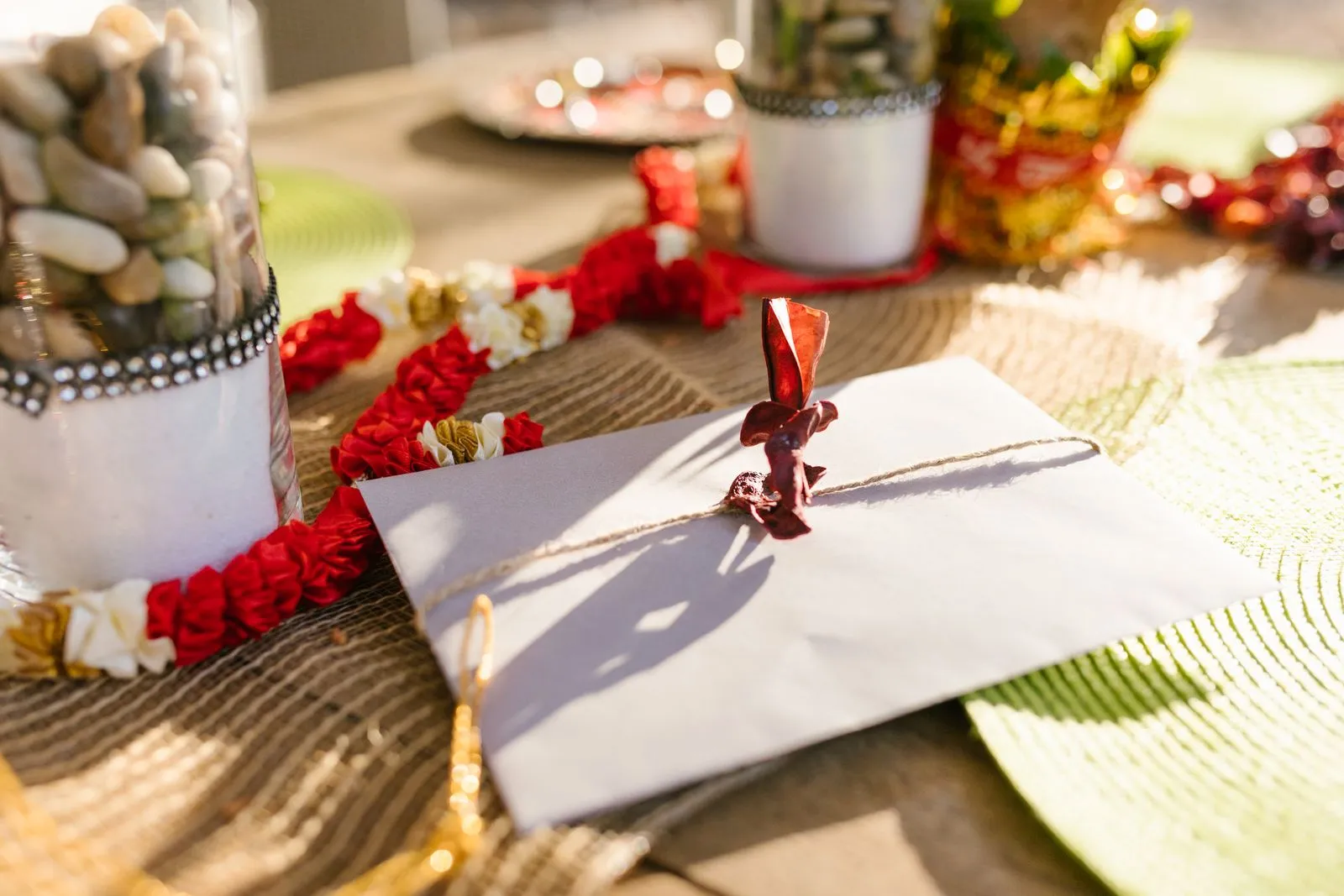 Festive Diwali decoration reference image with flowers and a gift envelope