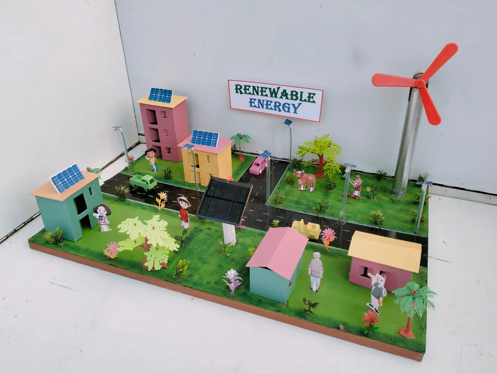 Handmade renewable energy working model with solar panels and wind turbine